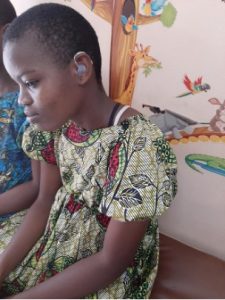 Faith after being fittedwith hearing aids 